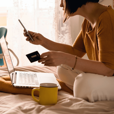 Woman at home online shopping on her laptop